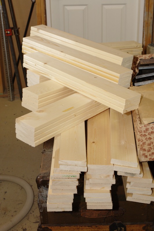 Production view of all the cut and stacked wood for the box walls